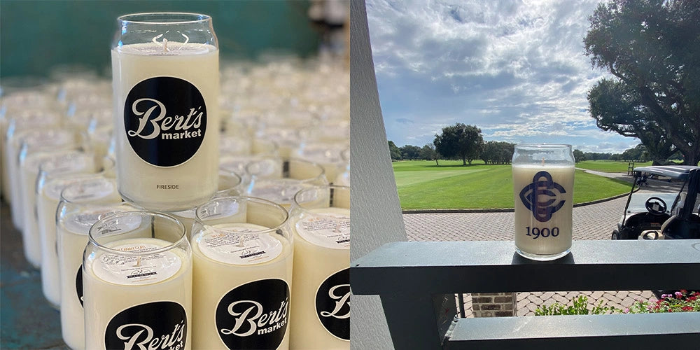 Candles with 'Ber's' branding on a table with a golf course in the background