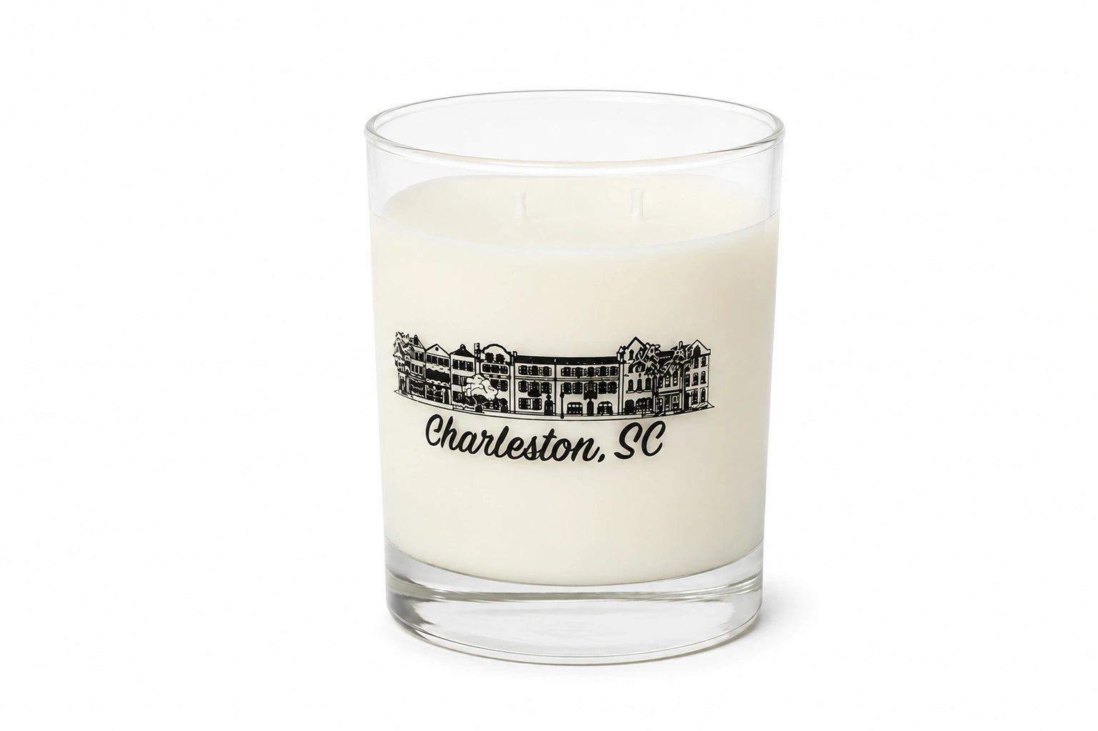 A white soy wax candle in a clear glass jar with a black printed illustration of a historic building and the text 'Charleston, SC' on the front, set against a plain white background.