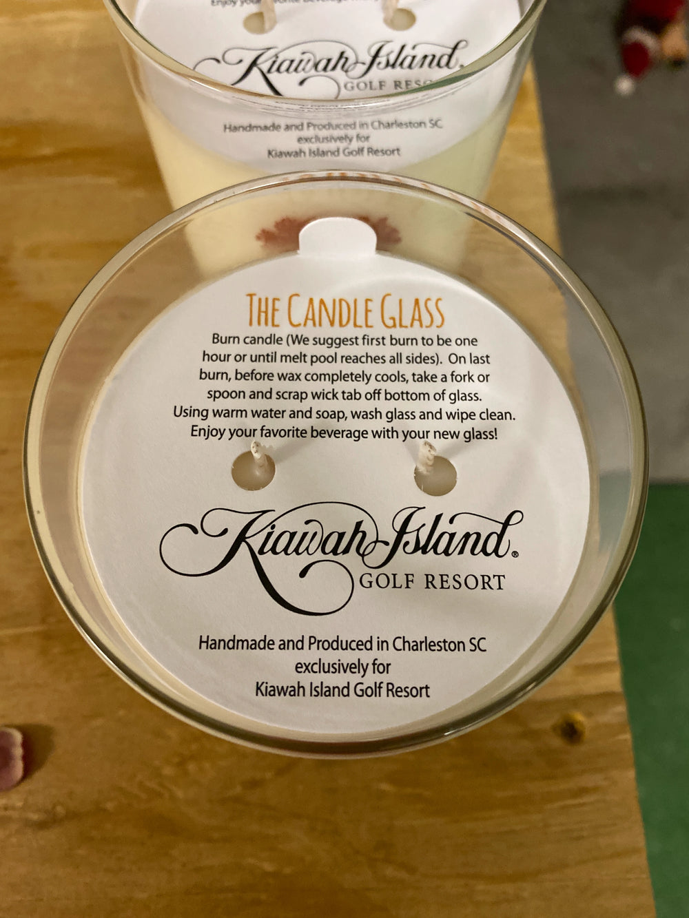 Candle glass with Kiawah Island Golf Resort label on a wooden surface