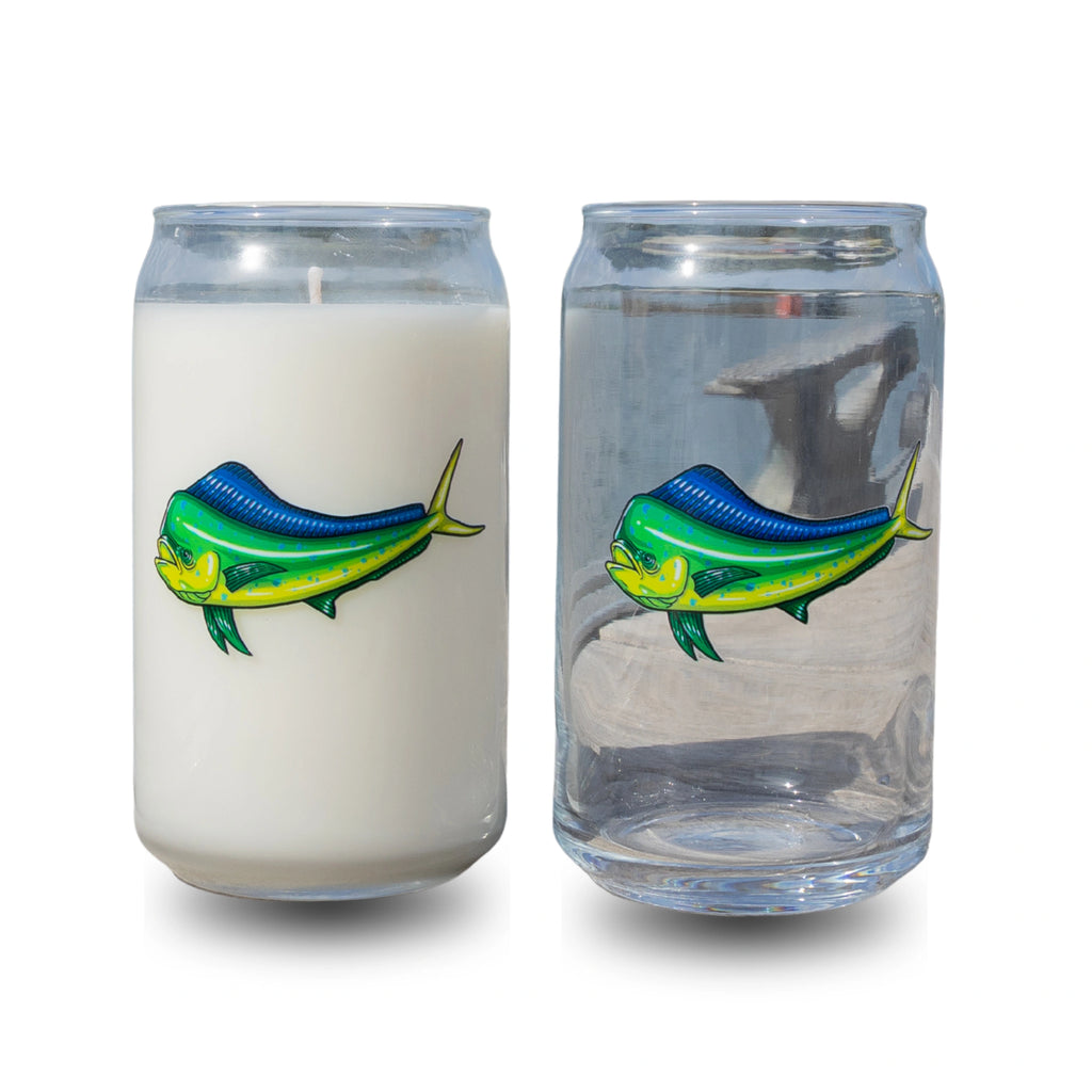 Candle and glass with fish design on a white background