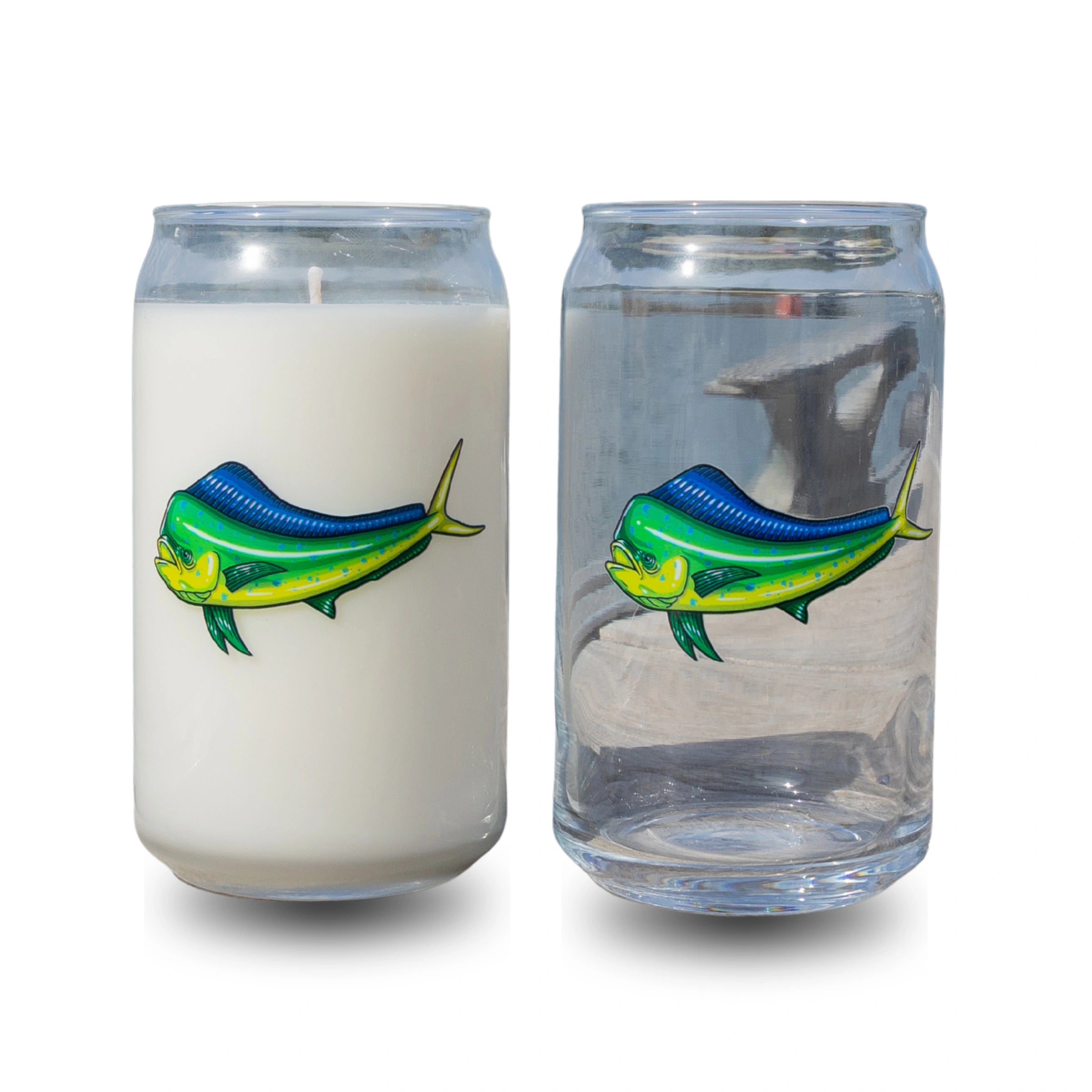 Candle and glass with fish design on a white background