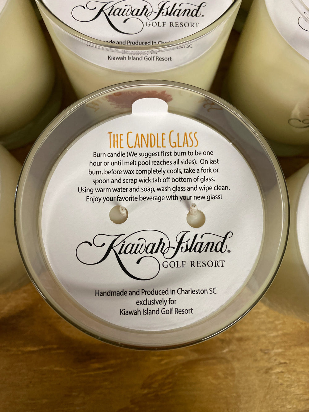 Candle glass with Kiawah Island Golf Resort label on a wooden surface