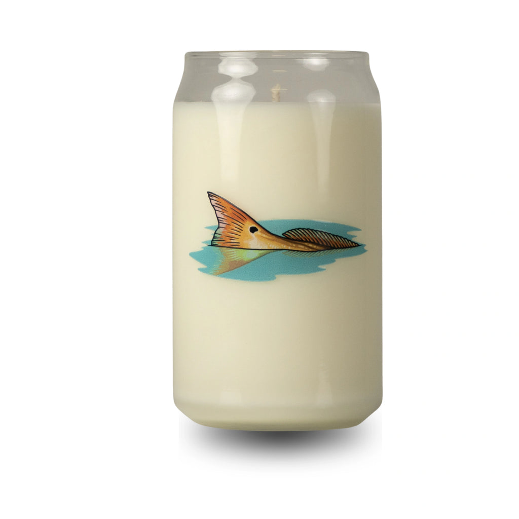 Candle in a glass jar with a fish design on a white background