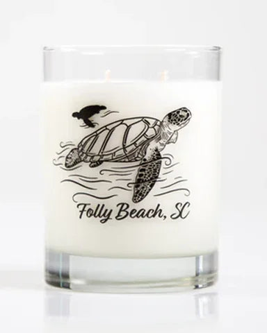 Candle with a turtle design and 'Folly Beach, SC' text on a white background
