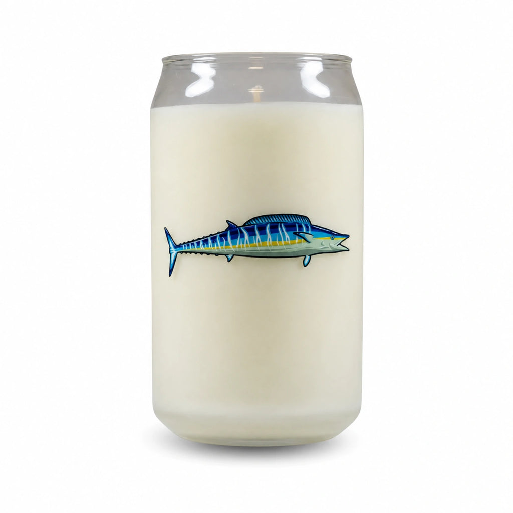 A frosted glass jar candle shaped like a beverage can, filled with off-white wax and featuring a blue and yellow striped fish graphic on the front, set against a plain white background.