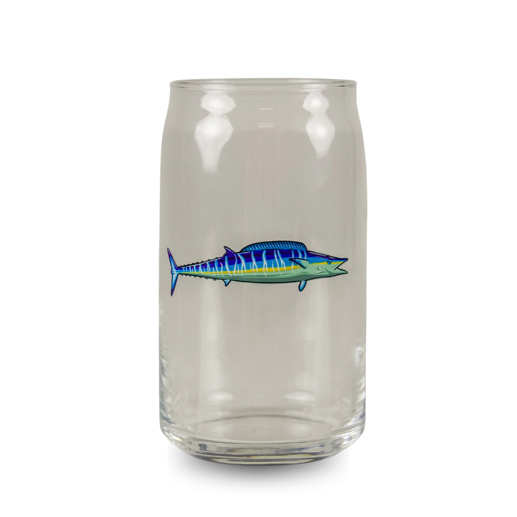 Clear glass tumbler with a blue fish design on a white background