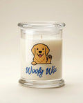 Candle in a glass jar with a dog illustration and 'Woofy Wix' text on a beige background