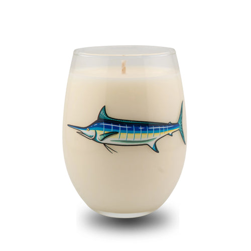 Candle in a glass container with a fish design on a white background