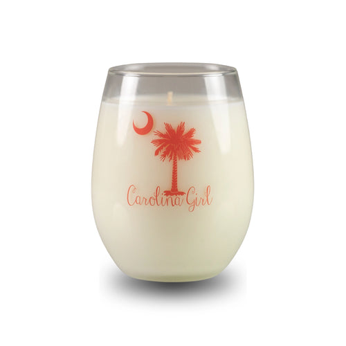 White candle in a glass container with 'Carolina Girl' text and palm tree design on a white background