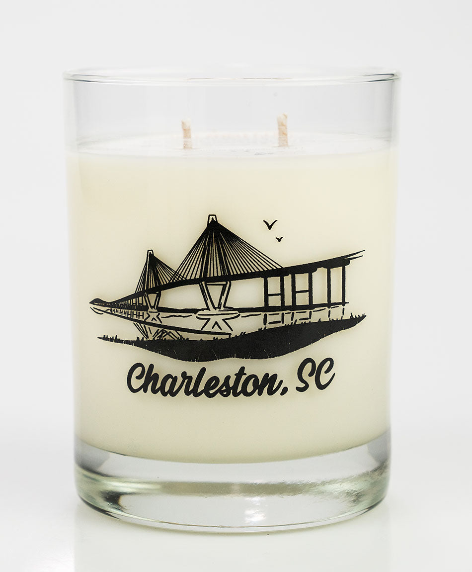 A clear glass whiskey glass with a black bridge design and the text 'Charleston, SC' at the bottom.